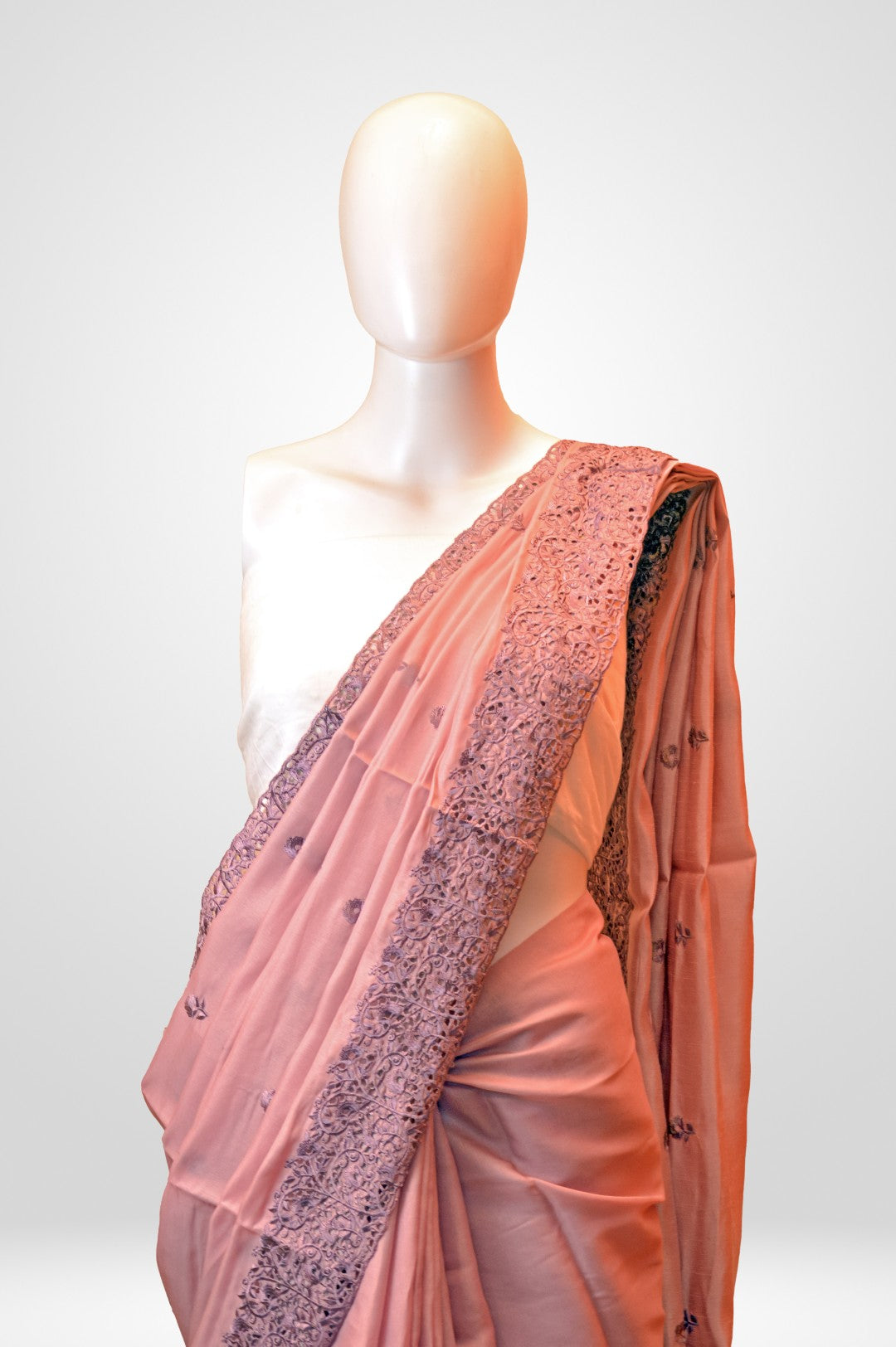 Kaloshmi casual saree  (semi silk, cut designed, pink colour),Draped on a dummy at a studio setup - close up front view
