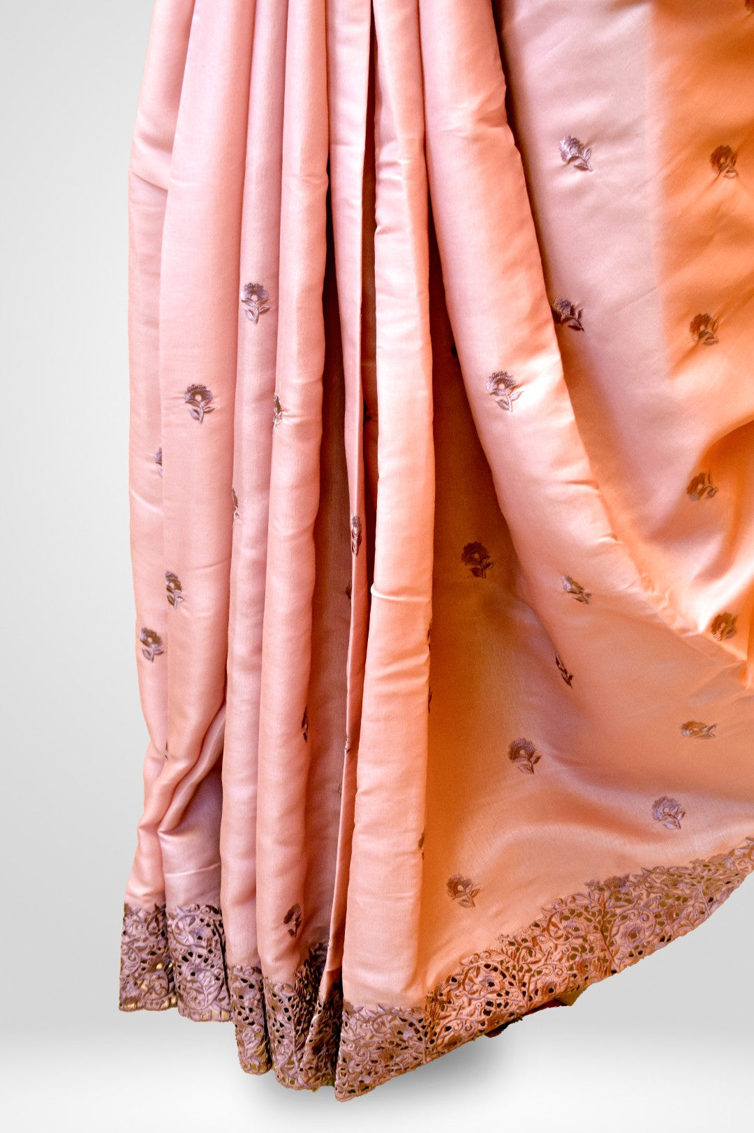  Kaloshmi casual saree  (semi silk, cut designed, pink colour),Draped on a dummy at a studio setup - close up bottom view
